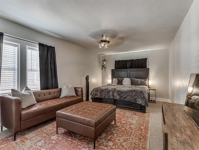 bedroom featuring a ceiling fan and baseboards