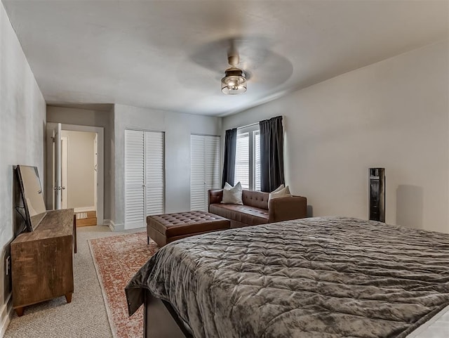 bedroom featuring baseboards, light carpet, and ceiling fan