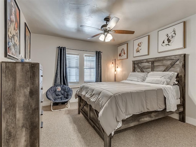 bedroom with baseboards, a ceiling fan, and carpet floors