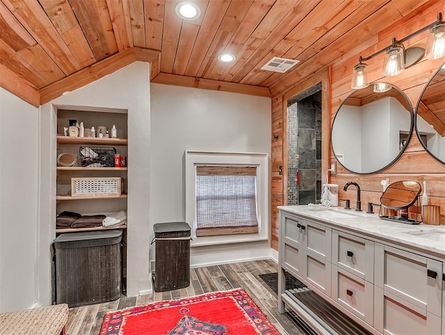 full bathroom featuring wood finished floors, wood ceiling, and a sink