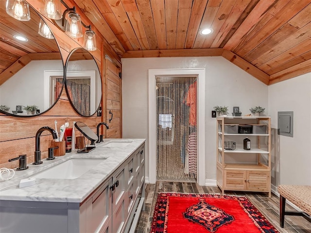 full bath featuring a sink, lofted ceiling, and wood ceiling