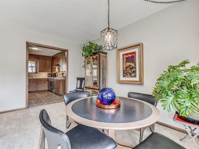 1802 N 15th St, Perry, OK 73077 - dining area with dark colored carpet and baseboards