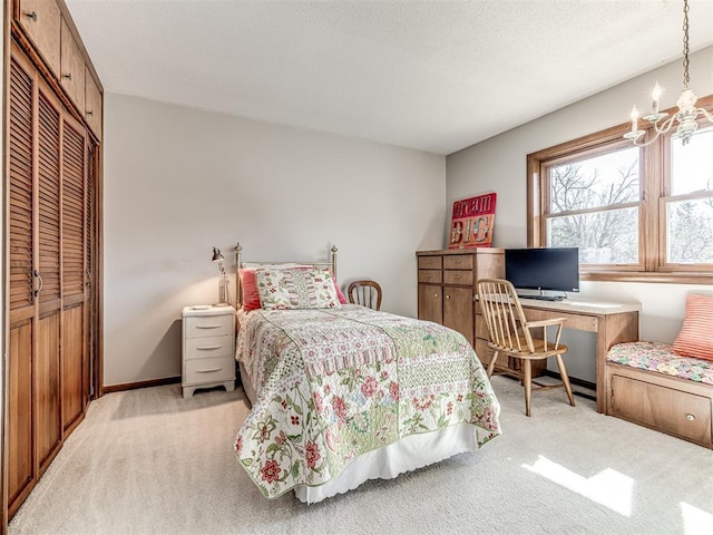 1802 N 15th St, Perry, OK 73077 - bedroom with light carpet, a chandelier, a desk, and a closet