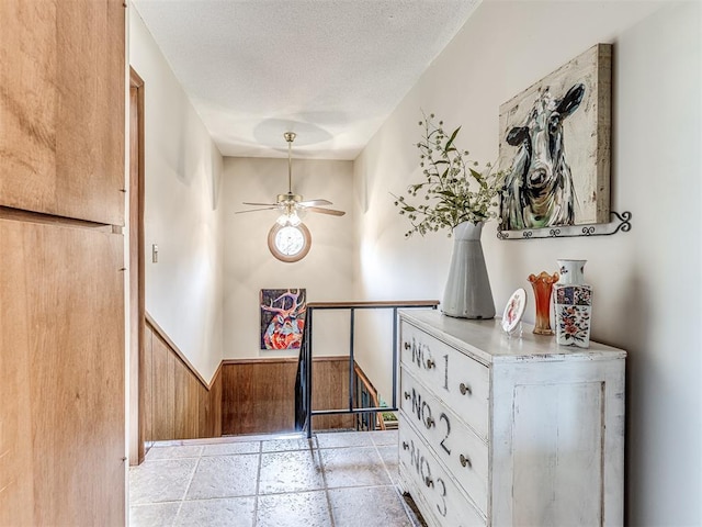 1802 N 15th St, Perry, OK 73077 - staircase featuring ceiling fan and a textured ceiling