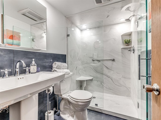 1802 N 15th St, Perry, OK 73077 - full bath with a marble finish shower and tile walls