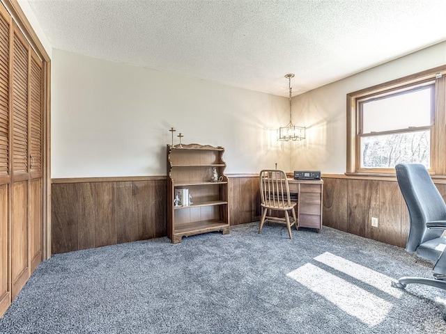 1802 N 15th St, Perry, OK 73077 - office featuring wainscoting, carpet floors, wood walls, a textured ceiling, and a chandelier