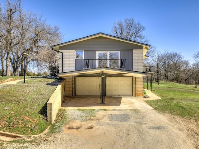 1802 N 15th St, Perry, OK 73077 - view of front of property with driveway, brick siding, a garage, and a front yard