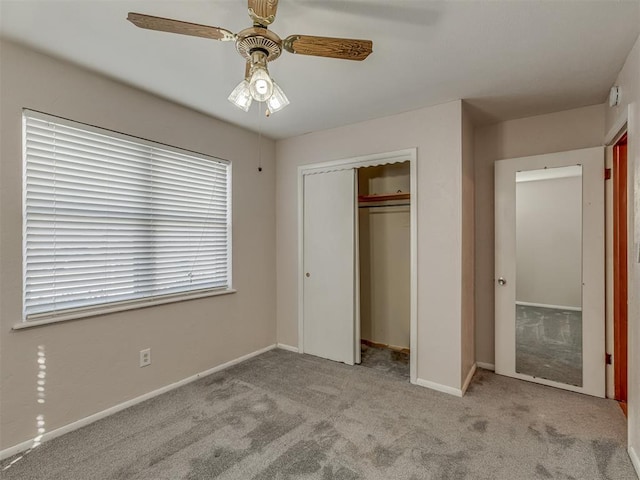 unfurnished bedroom with a ceiling fan, a closet, light colored carpet, and baseboards