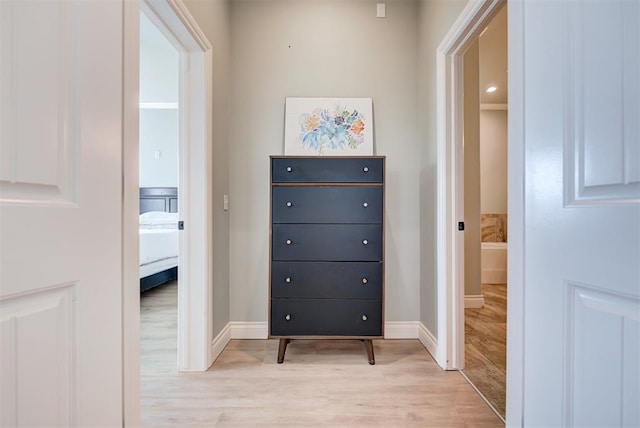 interior space with light wood-type flooring and baseboards