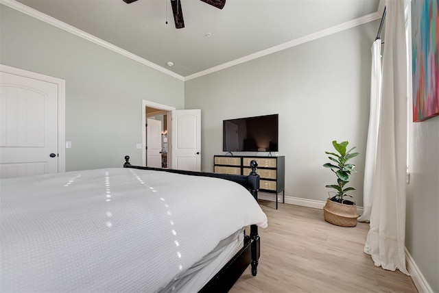bedroom featuring baseboards, ornamental molding, a ceiling fan, and light wood-style floors