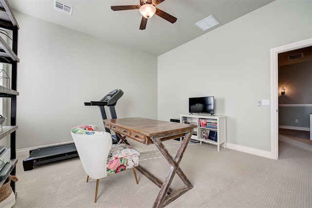 office area with baseboards, ceiling fan, visible vents, and light colored carpet