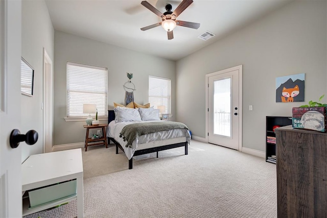 bedroom featuring light carpet, access to exterior, multiple windows, and visible vents