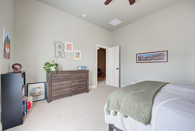 bedroom featuring a ceiling fan, light colored carpet, and baseboards