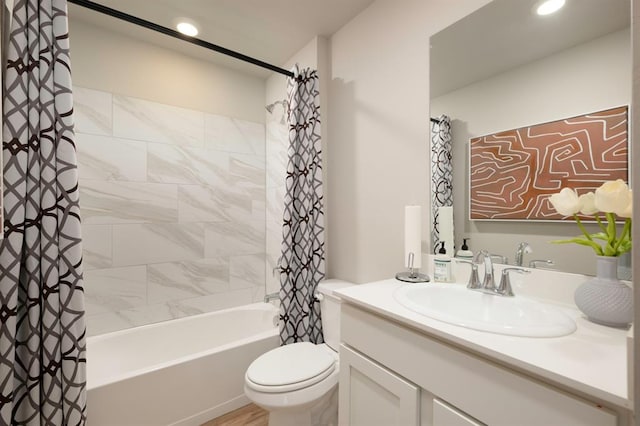 full bathroom featuring toilet, vanity, and shower / tub combo