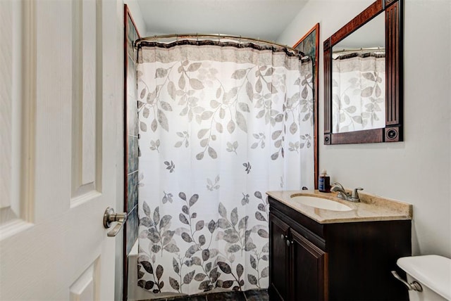 bathroom featuring toilet and vanity