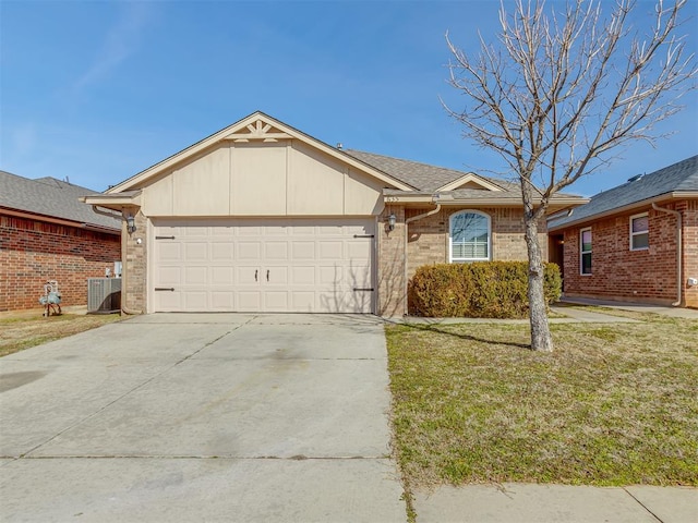 single story home with central air condition unit, a front yard, and a garage