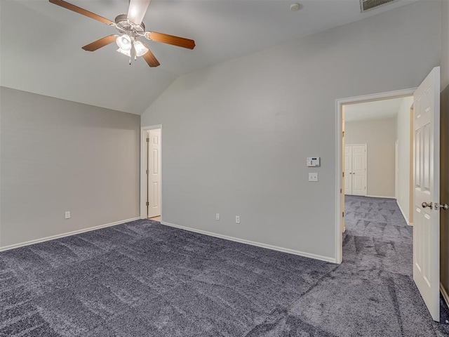 spare room featuring carpet, vaulted ceiling, and ceiling fan