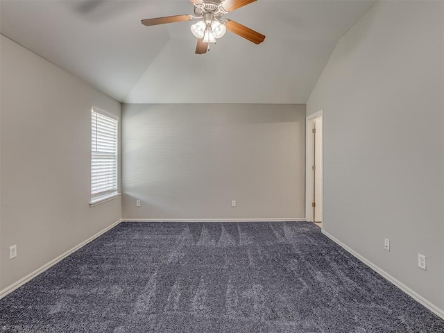 carpeted empty room featuring ceiling fan and lofted ceiling