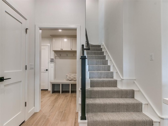 staircase with wood finished floors