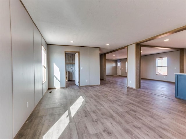 28992 Oakwood Meadows Dr, Cashion, OK 73016 - unfurnished living room featuring light hardwood / wood-style flooring