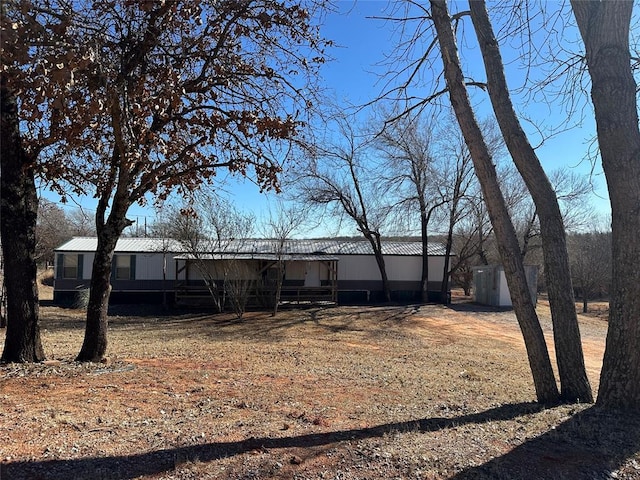 view of front of home featuring metal roof