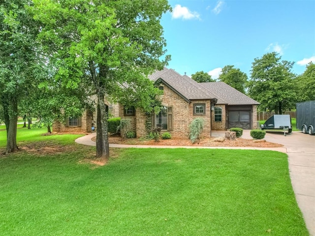 8275 Elk Grv, Blanchard, OK 73010 - view of front of house featuring brick siding, concrete driveway, a garage, and a shingled roof