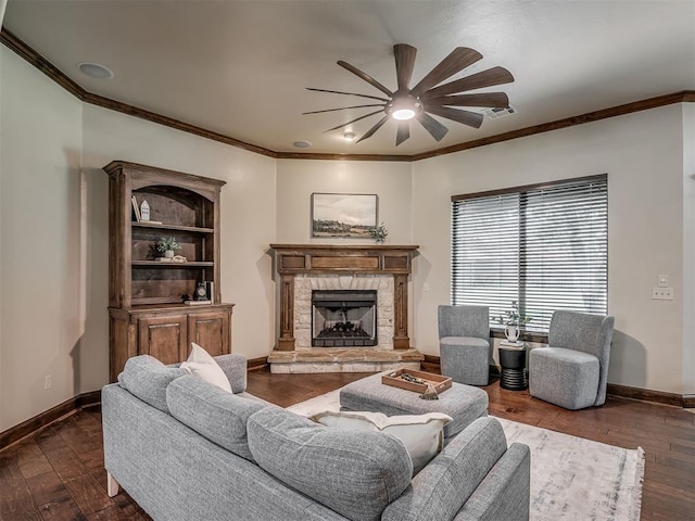 8275 Elk Grv, Blanchard, OK 73010 - living room with ceiling fan, a stone fireplace, ornamental molding, and hardwood / wood-style flooring