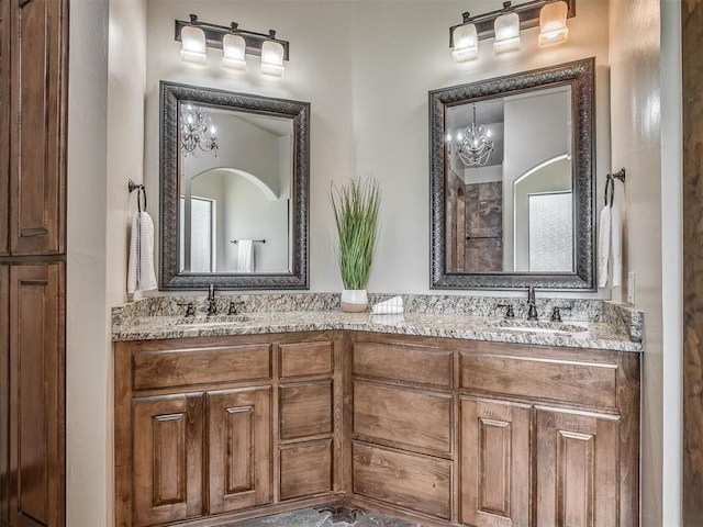 8275 Elk Grv, Blanchard, OK 73010 - bathroom featuring double vanity and a chandelier