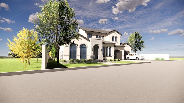 view of front of home with stucco siding, a tile roof, and a front yard