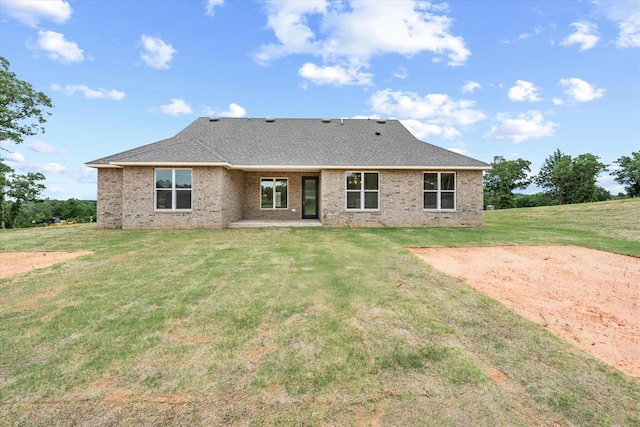 10949 Sandstone Ridge Way, Guthrie, OK 73044 - back of house with a patio area, a lawn, and brick siding