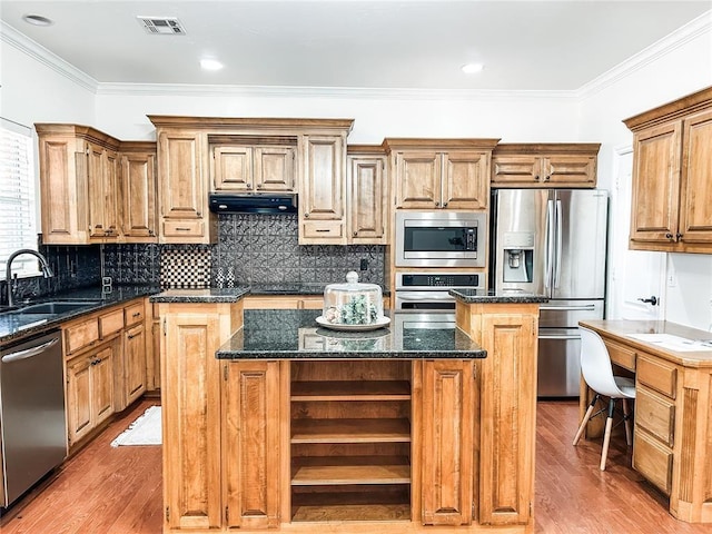 kitchen featuring under cabinet range hood, stainless steel appliances, a kitchen island, visible vents, and open shelves