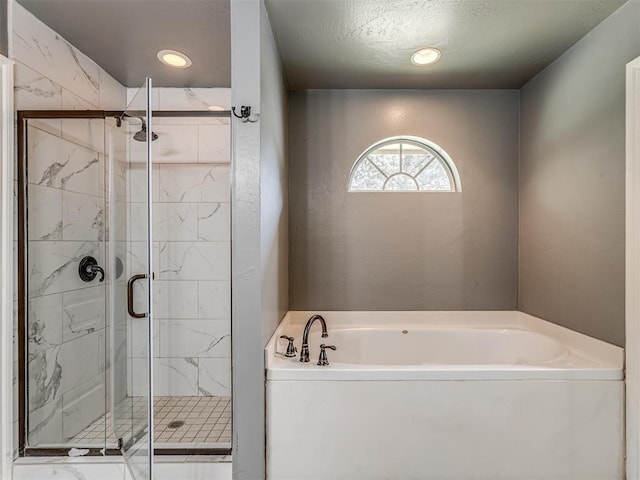 full bathroom featuring a stall shower, a bath, and recessed lighting