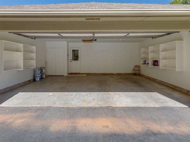 garage featuring baseboards