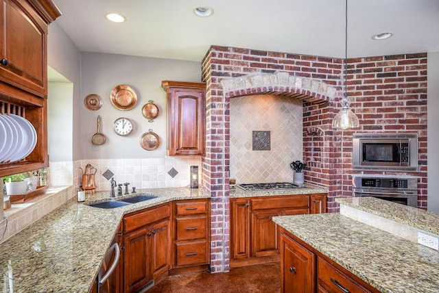 kitchen with backsplash, light stone countertops, recessed lighting, stainless steel appliances, and a sink