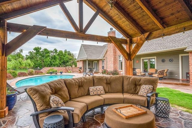 view of patio featuring outdoor lounge area, a gazebo, and a fenced in pool