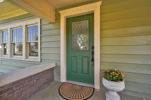 property entrance featuring covered porch