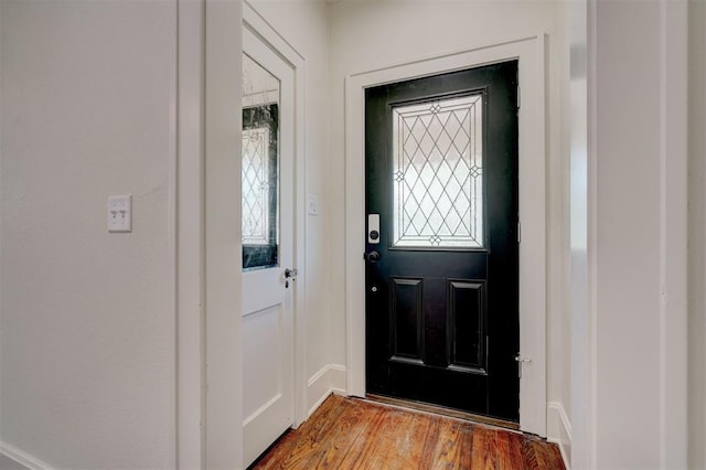doorway to outside with wood finished floors