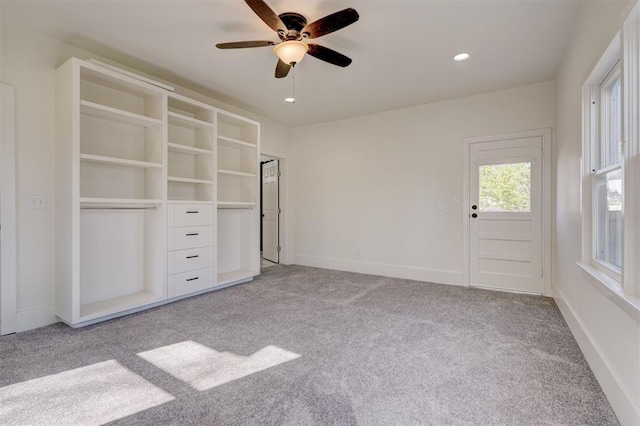 unfurnished bedroom with baseboards, recessed lighting, ceiling fan, and light colored carpet