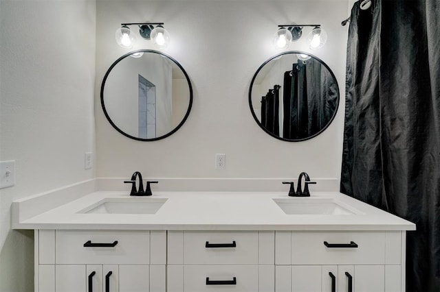 full bath with a sink and double vanity