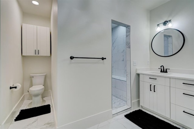 bathroom featuring vanity, toilet, marble finish floor, walk in shower, and baseboards