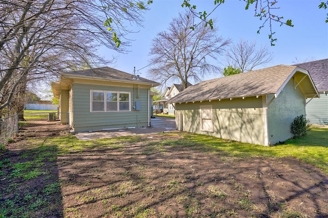 back of house with fence