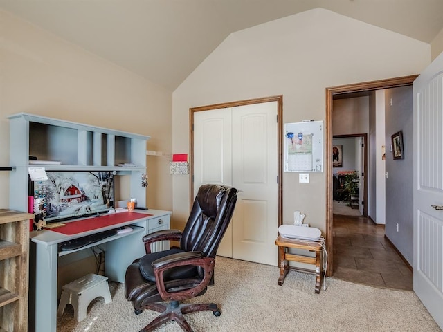 office featuring light colored carpet and vaulted ceiling