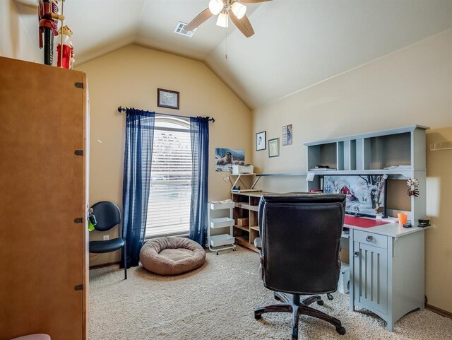 office featuring lofted ceiling, visible vents, ceiling fan, and carpet flooring