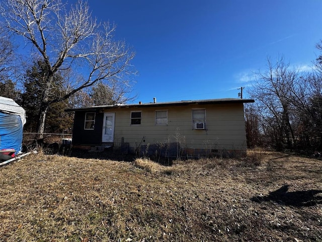 exterior space featuring cooling unit and crawl space