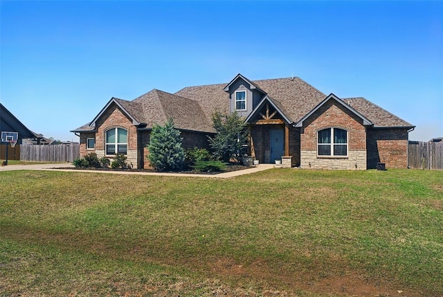 7201 SW 122nd St, Oklahoma City, OK 73173 - craftsman-style house featuring brick siding, stone siding, fence, and a front lawn