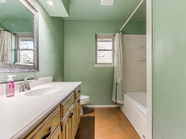 full bathroom featuring finished concrete floors, toilet, vanity, baseboards, and shower / tub combo with curtain