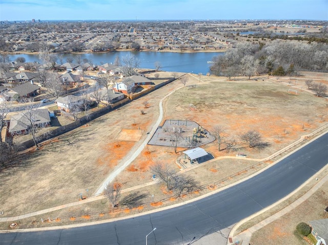 birds eye view of property featuring a water view and a residential view