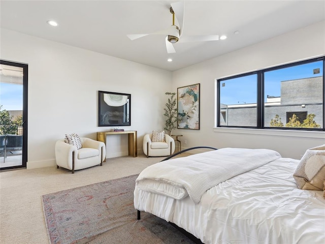 carpeted bedroom featuring a ceiling fan, recessed lighting, and baseboards