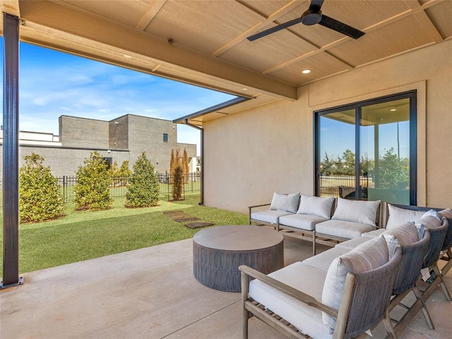 view of patio featuring an outdoor living space, fence, and a ceiling fan