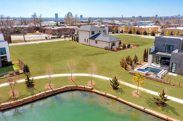 birds eye view of property with a water view